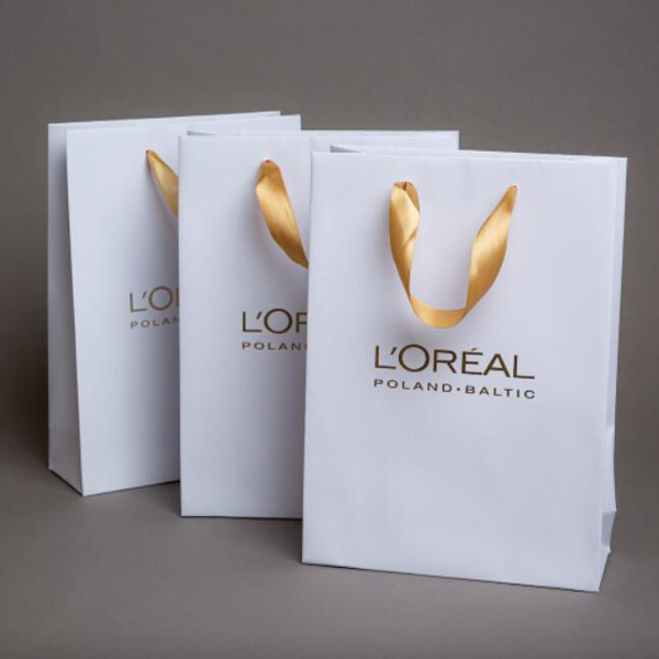 Loreal bag with golden ribbon